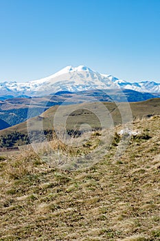 Landscape panorama Elbrus mountain with autumn hills