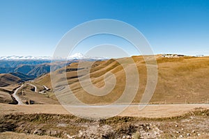 Landscape panorama Elbrus mountain with autumn hills