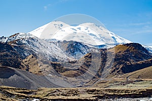 Landscape panorama Elbrus mountain with autumn hills