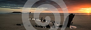 Landscape panorama ship wreck on Rhosilli Bay beach in Wales at