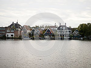 Landscape panorama of typical traditional houses in Zaanse Schans river canal Zaandijk Amsterdam Holland Netherlands