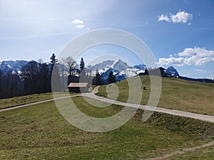 Landscape panorama view Eckbauer Alm mountain meadow near Garmisch.