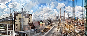 Landscape, panorama, view of factory slums with metal hulls and machines for the production of the coking industry,