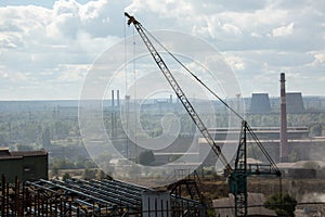 Landscape, panorama, view of factory slums with metal hulls and machines for the production of the coking industry,