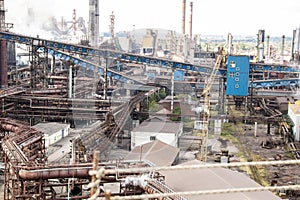 Landscape, panorama, view of factory slums with metal hulls and machines for the production of the coking industry,