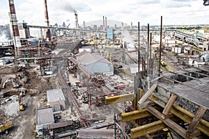 Landscape, panorama, view of factory slums with metal hulls and machines for the production of the coking industry,