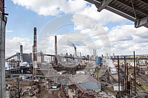 Landscape, panorama, view of factory slums with metal hulls and machines for the production of the coking industry,