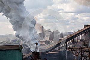 Landscape, panorama, view of factory slums with metal hulls and machines for the production of the coking industry,