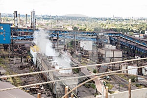 Landscape, panorama, view of factory slums with metal hulls and machines for the production of the coking industry,