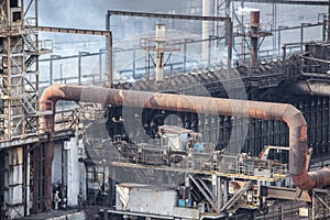 Landscape, panorama, view of factory slums with metal hulls and machines for the production of the coking industry,