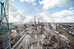 Landscape, panorama, view of factory slums with metal hulls and machines for the production of the coking industry,