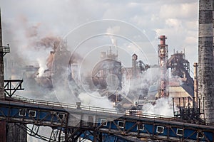 Landscape, panorama, view of factory slums with metal hulls and machines for the production of the coking industry,