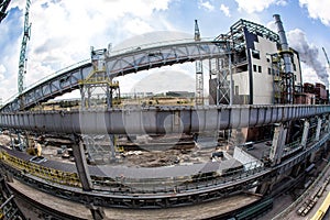 Landscape, panorama, view of factory slums with metal hulls and machines for the production of the coking industry,