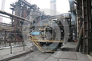 Landscape, panorama, view of factory slums with metal hulls and machines for the production of the coking industry,