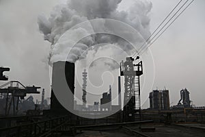 Landscape, panorama, view of factory slums with metal hulls and machines for the production of the coking industry,