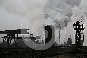 Landscape, panorama, view of factory slums with metal hulls and machines for the production of the coking industry,