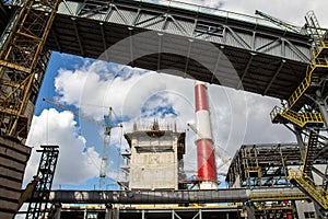 Landscape, panorama, view of factory slums with metal hulls and machines for the production of the coking industry,