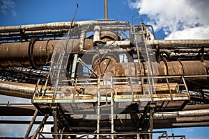 Landscape, panorama, view of factory slums with metal hulls and machines for the production of the coking industry,