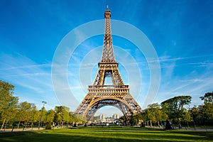 Landscape panoramic view on the Eiffel tower and park during the sunny day in Paris, France. Travel and Vacation concept