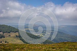 Landscape photo of the mountainous and hilly environment of the French Vosges region
