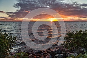 Landscape photo of the sea against the background of the sunset sky