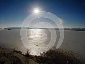 Landscape photo of sunset on a frozen lake in winter