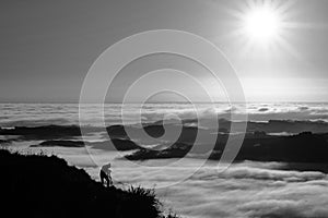 Landscape Photographer taking pictures of sunrise and morning fog atTe Mata Peak, Hawke`s Bay, New Zealand