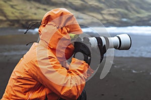 Landscape photographer at TjÃ¸rnuvÃ­k beach in the Faroe Islands