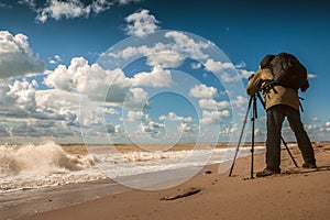 Landscape photographer work on sea coast