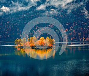Landscape photography. Great morning view of Eibsee lake with small islet.