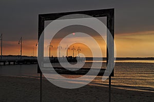 Landscape in picture frame from the beach at sunset