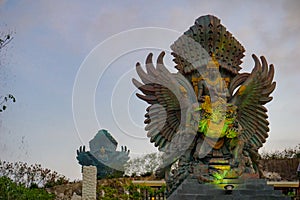 Picture of Garuda statue as Bali landmark with blue sky as a background. Balinese traditional symbol of hindu religion photo