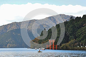 Landscape picture of lake and mountain with the red wooden shine