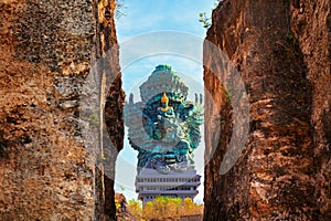 Landscape picture of old Garuda Wisnu Kencana GWK statue as Bali landmark with blue sky as a background. Balinese traditional