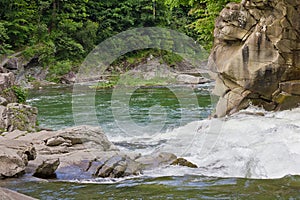 Landscape with a picturesque waterfall