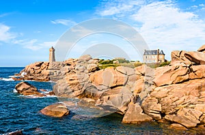 The Ploumanac`h lighthouse on the Pink Granite Coast in northern Brittany, France photo