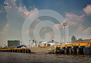 Landscape of the Port of Manila with giant rain clouds in the background.