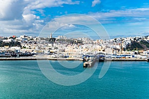 Landscape of the port of Tanger-Med under the sunlight and a blue cloudy sky in Morocco