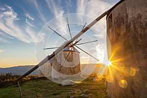 Landscape of Portuguese Stone Windmills with Sunset Starburst