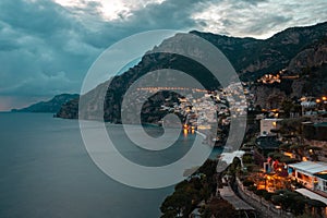 Landscape with Positano town at famous amalfi coast at sunset, Italy