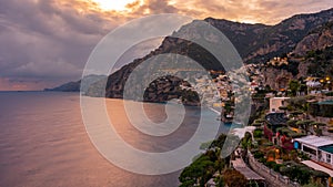 Landscape with Positano town at famous amalfi coast at sunset, Italy