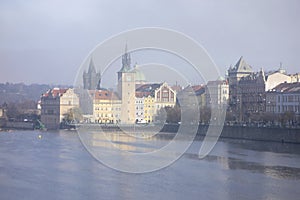 Landscape of Prague and Vltava river at Novoneho lavka in misty autumn morning