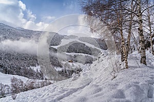 Landscape with Pyrenees Mountains in Andorra , Grandvalira ski area in El Tarter in winter day photo