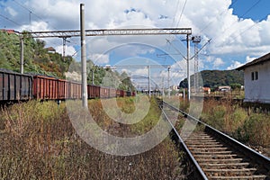 Landscape with railroad rails and train