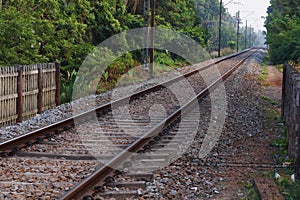 Landscape of railroad tracks in India cutting across rural countryside