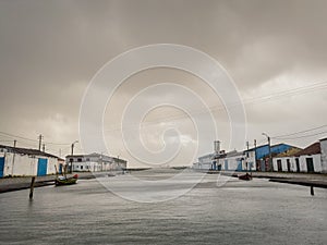 Landscape on a rainy day at Ribeira pier or salt pier in Ovar, ria de Aveiro, Portugal photo