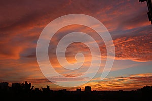 landscape with red clouds against the sky at sunset russia