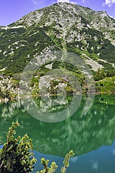 Landscape with Reflection of Hvoynati peak in Okoto lake, Pirin Mountain