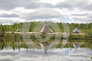 Landscape with reflection in the water Nenets plague in Northern Siberia