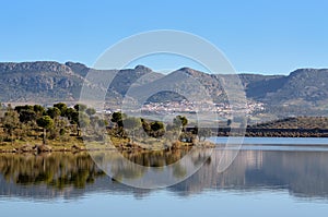 Landscape with reflections in reservoir